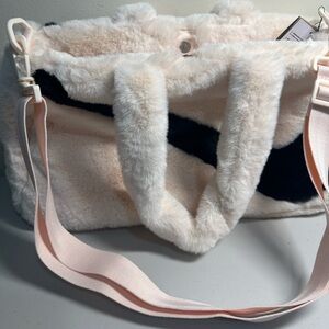 Nike bag with a strap a small pocket zipper inside